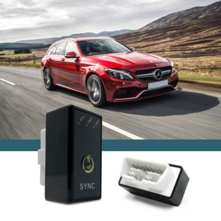 red Mercedes Benz car driving down road - chip your car performance chips
