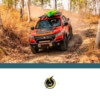 red and black truck driving in the forest with a green kayak on the top - chip your car performance chips