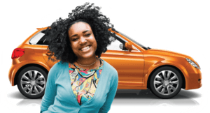 smiling young woman in front of orange car - chip your car performance chips