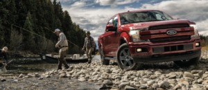 two men fishing near red Ford truck - chip your car performance chips