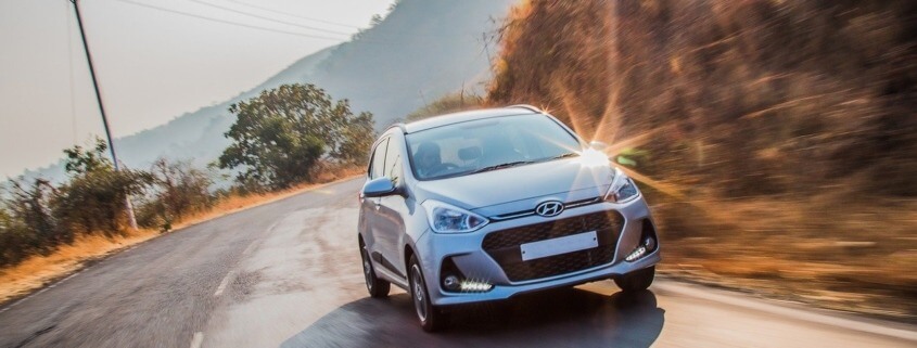 Silver Hyundai vehicle driving on road - Hyundai Performance Chips boost horsepower
