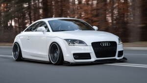 White Audi driving near forest - Chip Your Car Audi Performance Chips Improve Horsepower