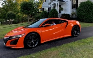 orange honda parked in driveway - Honda Performance Chips Improve Gas Mileage