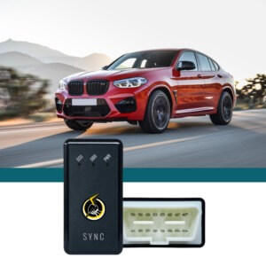 red BMW driving on road - chip your car performance chips