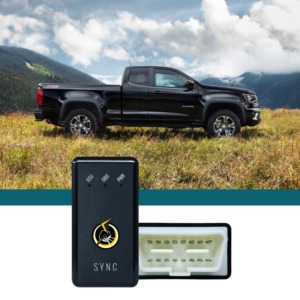 black truck in grass patch - chip your car performance chips