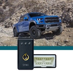 blue Ford truck driving on big boulders and rocks - chip your car performance chips
