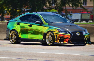 colorful Lexus driving down street - chip your car performance chips