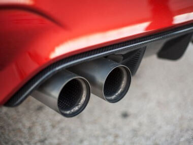 red car with dual exhaust - chip your car performance chips