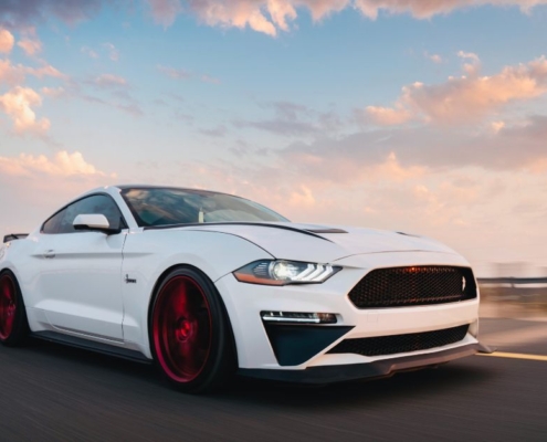 white sports car driving during sunset - chip your car car tuner