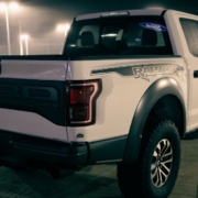 white Ford F150 Raptor truck parked at night - chip your car performance chip